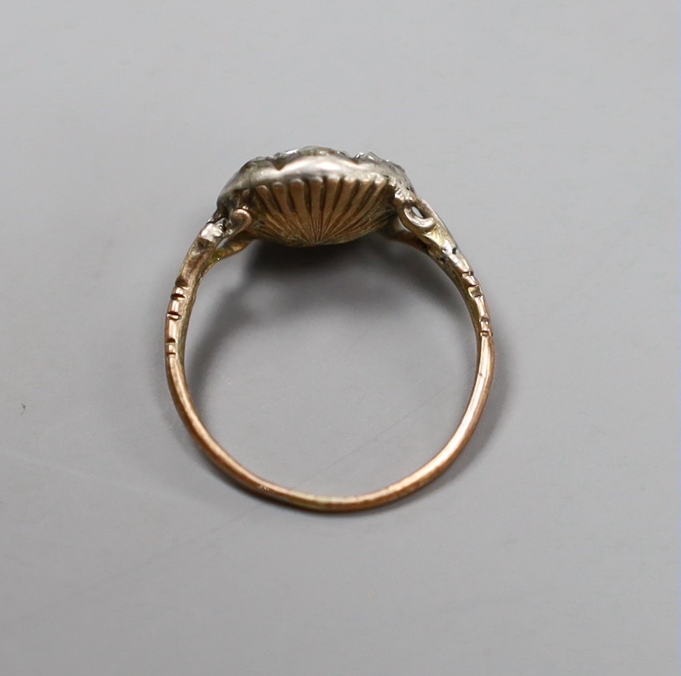An early 19th century gold and silver mounted rose diamond cluster ring, size E, gross 1.7 grams